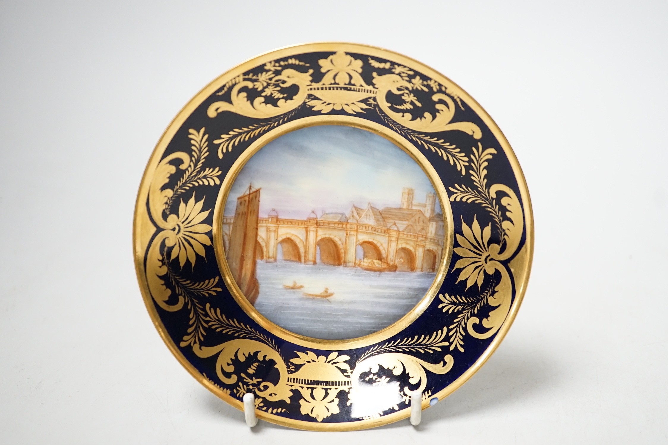 A Continental Derby style cup and saucer, 8cm tall overall